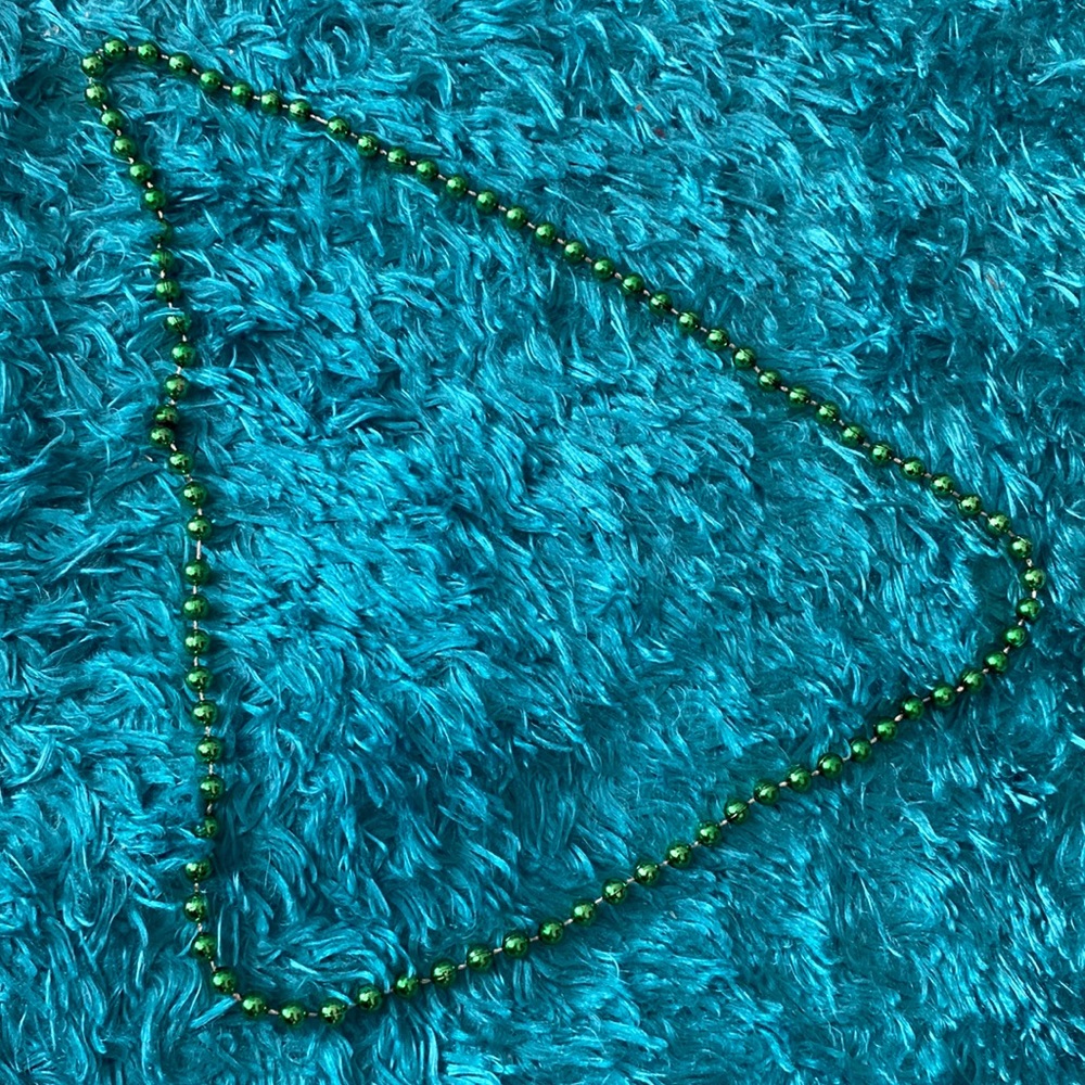 Green plastic spherical beads necklace